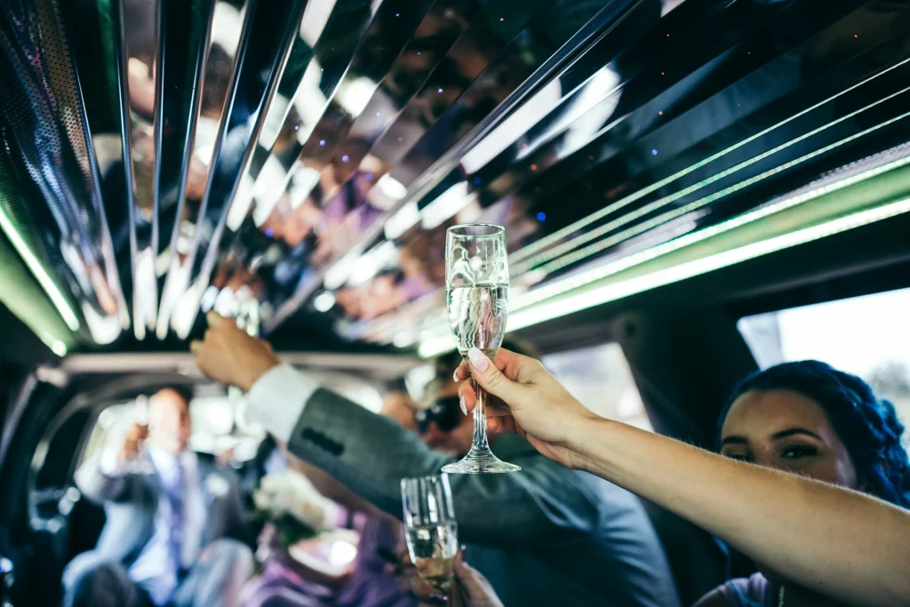 people celebrating in a limo